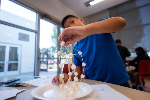City of Sacramento Young Leaders participant building a teamwork project
